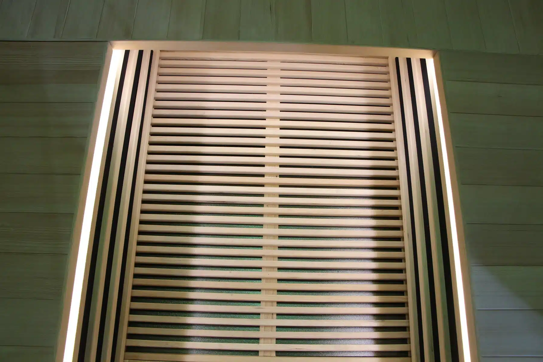 Bropool IS-1104 indoor sauna heater guard detail behind vertical wood slats